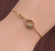 Bracelet doré raquette de tennis ajustable